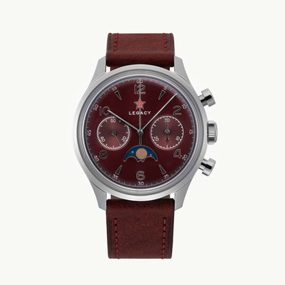 A luxury wristwatch with a silver-toned stainless steel case, a dark red dial featuring a moon phase indicator and the 'LEONACY' brand name, and a matching dark red leather strap.